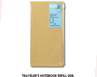 May include: A yellow Traveler's Notebook refill 008 zipper case. The case has a zipper closure and three pockets. The text "TRAVELER'S COMPANY" is printed on the case.