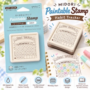 Puede incluir: Un sello Midori Paintable Stamp Habit Tracker con tinta marrón a base de aceite. El sello cuadrado presenta una cuadrícula de calendario mensual con los números del 1 al 31, ilustraciones de gatos y el texto Habit Tracker, Monthly, good.
