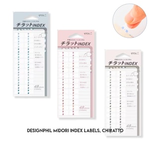 May include: Three packs of Midori Chiratto index labels in blue, pink, and grey. Each pack contains 48 adhesive tabs featuring Japanese text and branding. The labels are designed to extend 2.5mm from a page edge, allowing for organised indexing.