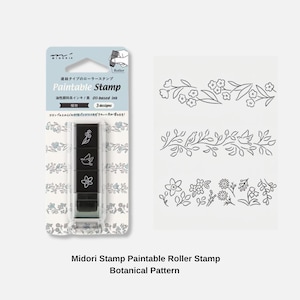May include: A Midori Paintable Stamp roller featuring three black stamp heads with botanical and bird designs. The packaging includes the text "Paintable Stamp" and "3 designs" with a white background showing the printed patterns of flowers.