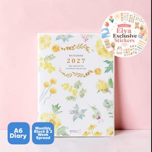 May include: A white A6 diary for 2027 featuring yellow floral watercolour illustrations. The cover text reads DATEBOOK 2027 and May tomorrow be a wonderful day for you. A circular sticker sheet insert is included with various small graphic designs.