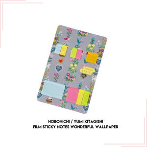 May include: A gray memo board with a floral pattern and colorful sticky notes. The sticky notes are arranged in a grid pattern and have different colors and sizes. The board also has the text "TOOLS & TOYS" printed on it. Hobonichi / Yumi Kitagishi Film Sticky Notes Wonderful Wallpaper.