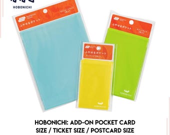 May include: Three clear plastic pockets with the text "ふやせるポケット" (meaning "expandable pocket") in Japanese. The pockets are labeled with different sizes: postcard, ticket, and card.
