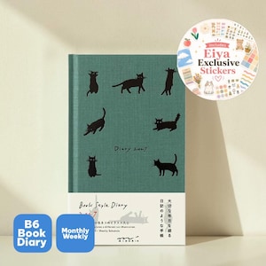 May include: A green B6 diary for 2027 featuring black cat illustrations on the cover. The book includes a white paper band with the text Book Style Diary 2027 and Japanese characters. A circular sticker sheet insert shows various small colorful icons.