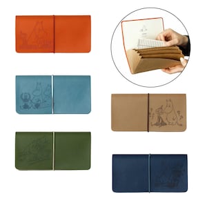 May include: A collection of five rectangular accordion-style organizers in orange, blue, green, tan, and dark blue. Each features a Moomin character illustration and an elastic closure band. One open organizer reveals internal paper dividers.