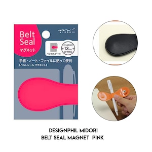 May include: A pink Midori Belt Seal magnet for notebooks and journals, featuring a magnetic closure and a pen holder loop. The packaging displays the product name, a 13mm pen diameter capacity, and instructions for attaching the adhesive seal to paper.