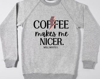 May include: A gray sweatshirt with a black graphic that says "COFFEE makes me NICER. WELL, MOSTLY."