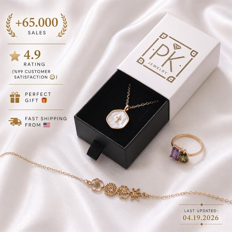 May include: A jewelry set featuring a gold necklace with a white pendant and cross, a ring with purple and green stones, and a floral bracelet. The jewelry is displayed in a white box with the "PK JEWELRY" logo. The image also shows the text "+65.000 SALES".