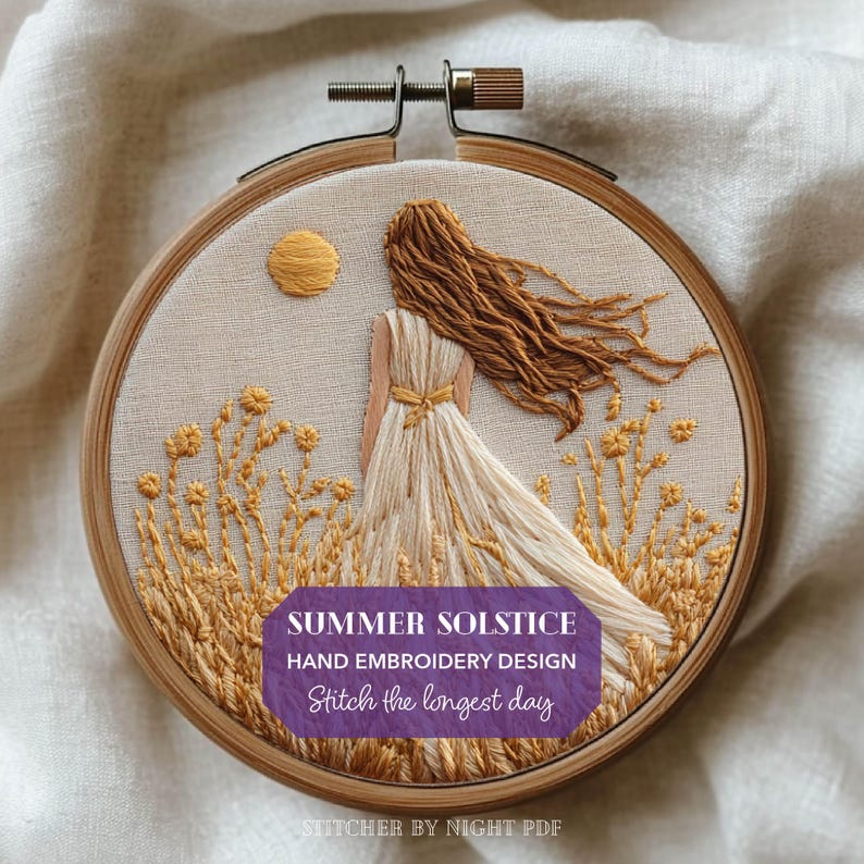 May include: Hand embroidery design in a wooden hoop. The design features a woman in a flowing white dress, with long brown hair, standing in a field of yellow flowers. A yellow sun is in the sky. The text reads "Summer Solstice Hand Embroidery Design Stitch the longest day."
