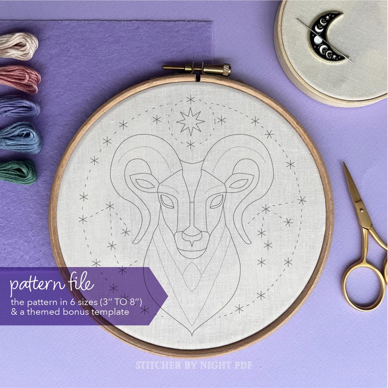 May include: A white embroidery hoop with a black and white line drawing of a ram's head with stars around it. The text "pattern file" is in the lower left corner. The text "the pattern in 6 sizes (3" TO 8") & a themed bonus template" is below the text "pattern file". The text "STITCHER BY NIGHT PDF" is in the lower right corner.