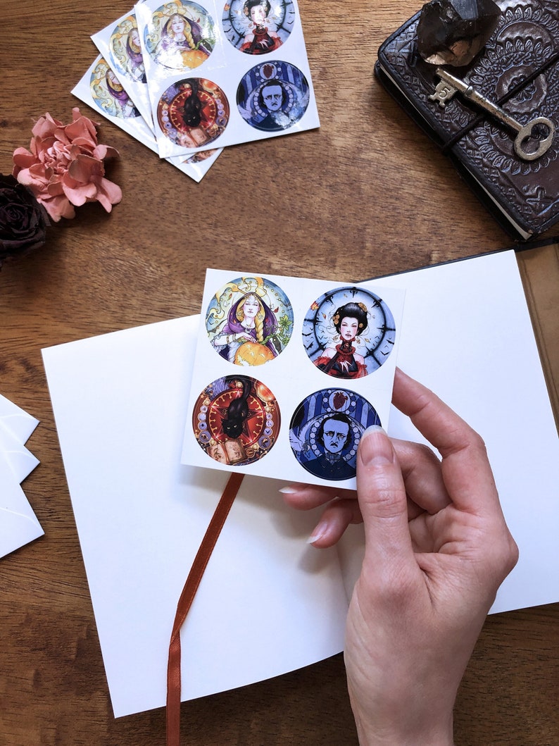 May include: Set of six round stickers featuring illustrations of a woman with a crown, a woman with a clock, a black cat, and a man with a clock. The stickers are on a white background.