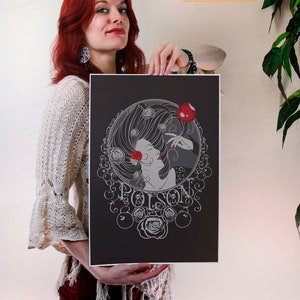 May include: A black and white illustration of a woman with long hair holding a red apple. The illustration is surrounded by a circle of roses and the word "Poison" is written in a decorative font.