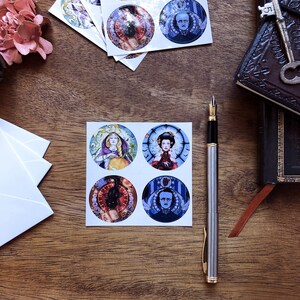 May include: Set of six round stickers featuring colorful illustrations of women and men with intricate details. The stickers are printed on white paper and have a glossy finish.