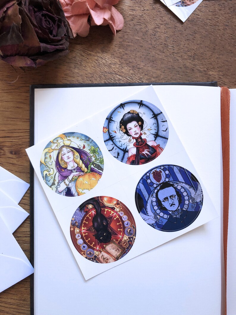 May include: Four round stickers with colorful illustrations. The first sticker features a woman with long blonde hair wearing a purple robe and holding a pumpkin. The second sticker features a woman with dark hair wearing a red dress and a clock behind her. The third sticker features a black cat sitting on a book with a red star and other symbols around it. The fourth sticker features a man with a beard and a white collar wearing a blue suit with a heart and other symbols around him.
