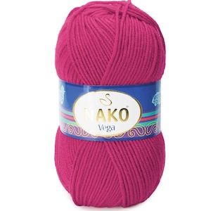 May include: A ball of bright pink yarn with a blue label that says "NAKO Vega" and "Wool Touch".