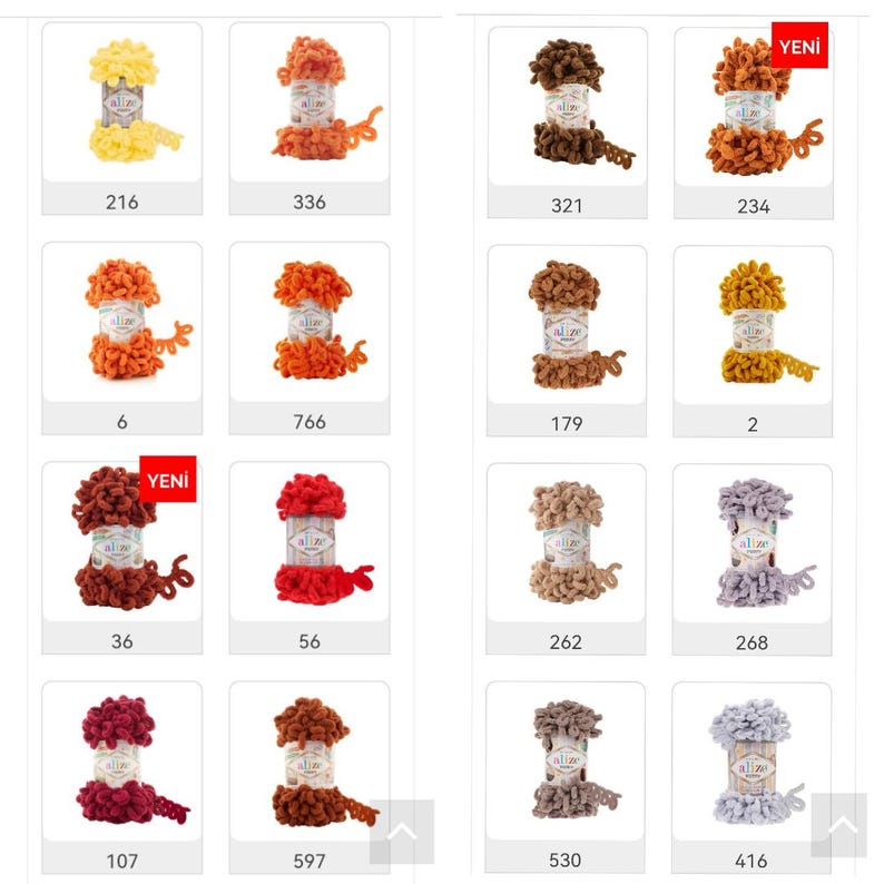 May include: Assortment of colorful yarn spools in various shades of orange, brown, red, and gray. The yarn is fluffy and textured. The spools are labeled with numbers.