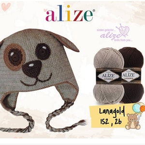 May include: A brown and beige knitted hat with a dog face design. The hat has a long, braided tie. Two balls of yarn are shown in beige and brown. The yarn is labelled "Alize Lanagold 152, 26".