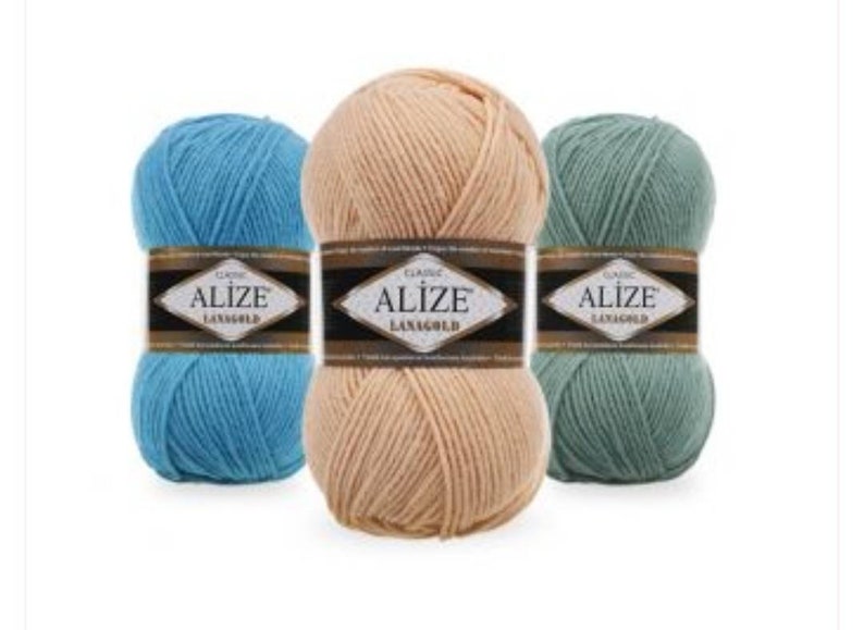 May include: Three balls of yarn in blue, beige, and green. Each ball has a label that reads "Alize Classic Lanagold".