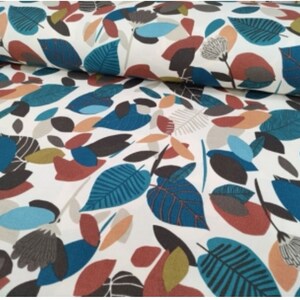 May include: White fabric with a repeating pattern of teal, brown, orange, and beige leaves. The leaves are stylized and abstract.