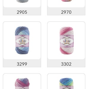 May include: A collection of Alize Cotton Gold yarn skeins in various colors. Each skein is wrapped with a label displaying the brand name and color code. The color variations include shades of gray, pink, blue, and purple.
