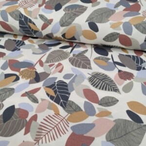May include: White fabric with a repeating pattern of stylized leaves in shades of brown, gray, blue, pink, and beige.