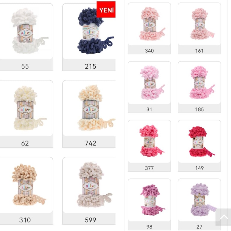 May include: A variety of yarn colors in a grid format. The yarn is fluffy and has a pom-pom texture. The colors include white, cream, beige, pink, light pink, dark pink, purple, blue, and navy blue. The yarn is labeled "Alize" and the numbers 55, 62, 310, 215, 742, 599, 340, 161, 31, 185, 377, 149, 98, and 27 are visible.