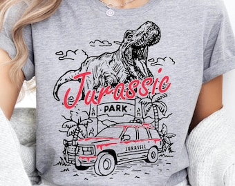 Maglietta Jurassic Park, Maglietta Jurassic World, Maglione Dinosauro T-rex, Maglietta Jurassic Trip, Felpa Dino, Maglietta Disney Jurassic Trip
