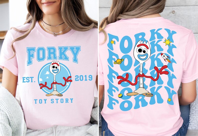 a woman wearing a pink shirt with a cartoon character on it