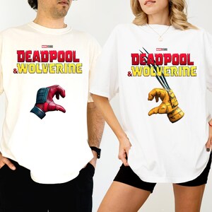 a man and a woman wearing deadpool and wolverine t - shirts