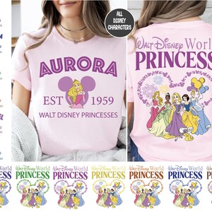a woman wearing a pink shirt with princesses on it