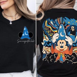 a woman wearing a mickey mouse t - shirt