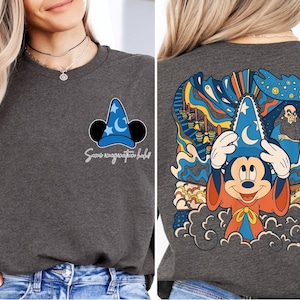 a woman wearing a mickey mouse t - shirt