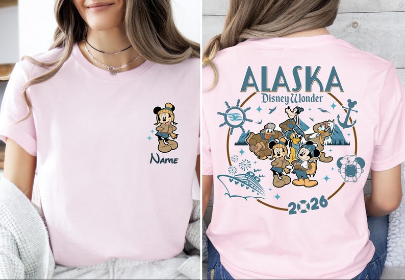 A woman wearing a pink t-shirt with a Disney-themed design, including Mickey Mouse and Minnie Mouse characters, along with the text "Alaska DisneyWonder".