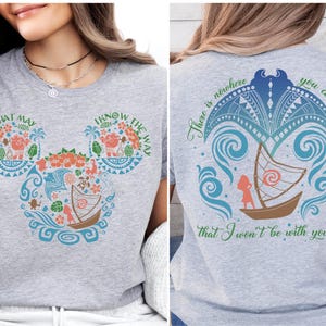 a woman sitting on a bench wearing a mickey mouse shirt