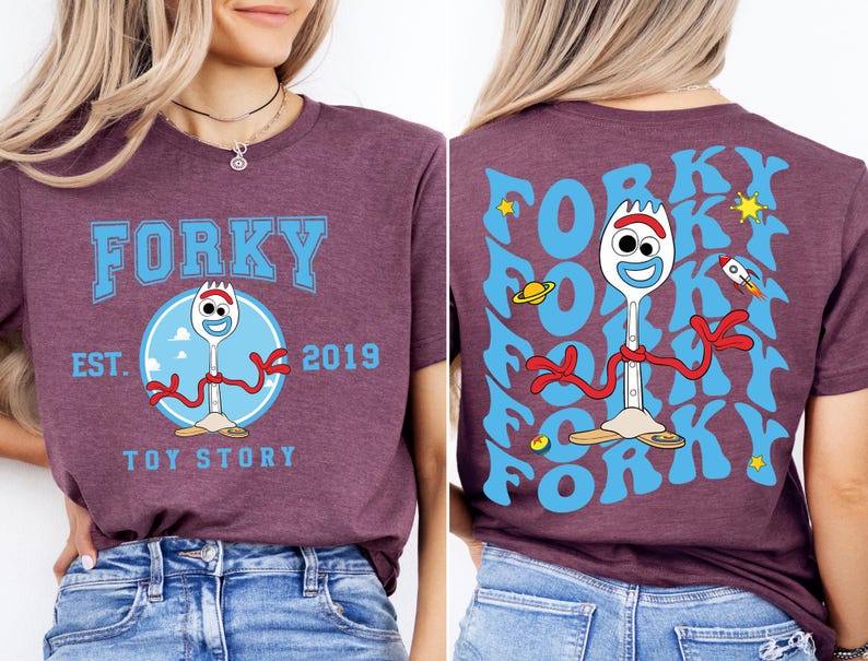 a woman wearing a forky tshirt and jeans