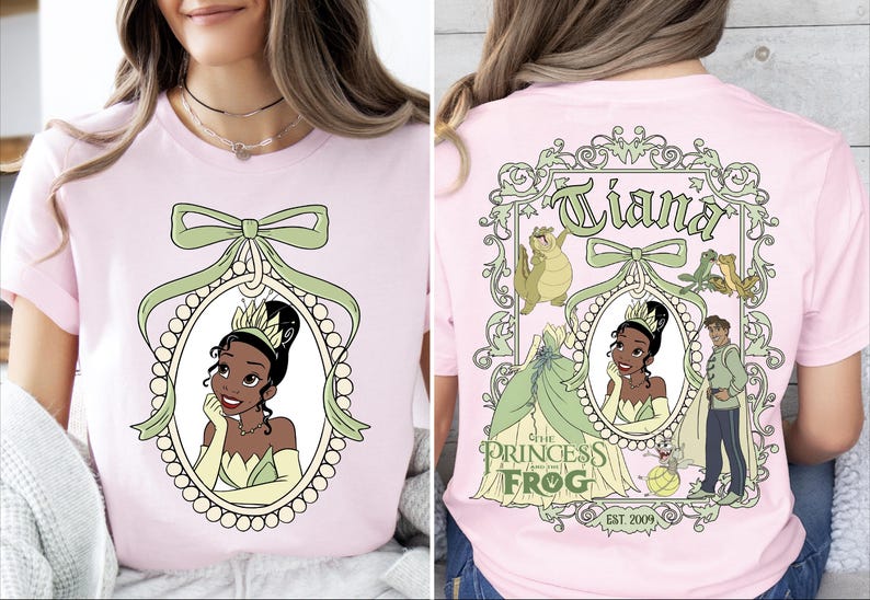 A woman wearing a pink t-shirt with a design featuring a cartoon image of a young girl, along with the text "Tiana the Princess Frog" and "Est. 2009".