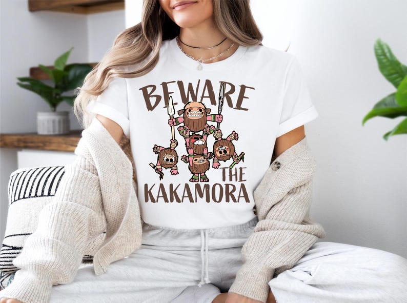 a woman sitting on a couch wearing a t - shirt that says beware of