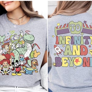a woman wearing a t - shirt with cartoon characters on it