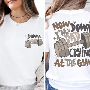a woman wearing a t - shirt that says, now i'm down,