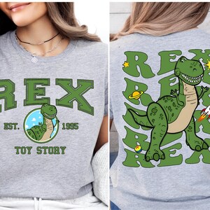 a woman wearing a t - shirt with a dinosaur on it