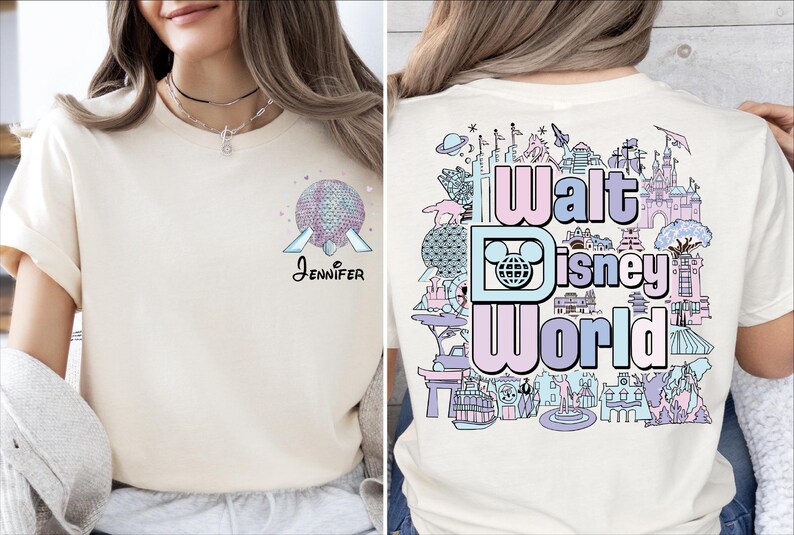 A woman wearing a white t-shirt with a Disney World-themed design on the back.