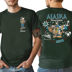 a man wearing a green t-shirt with a graphic design on the back.