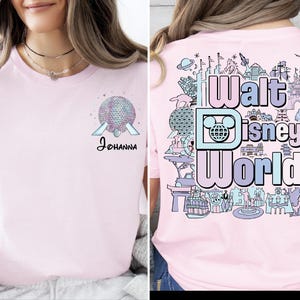 A woman wearing a pink t-shirt with a Disney World logo and various Disney-themed illustrations on the back.