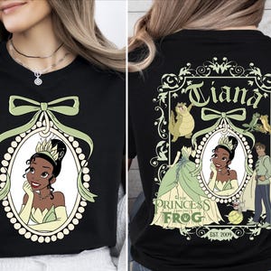 The image is a collage of two photos. The left photo shows a woman wearing a black t-shirt with a graphic of a princess and a frog, while the right photo shows the back of the same t-shirt with the text "Tiana" and "The Princess Frog" printed on it.