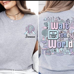 A woman wearing a gray t-shirt with a graphic design of Disney World on the back.