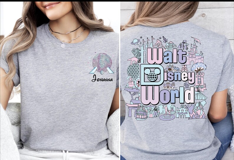 A woman wearing a gray t-shirt with a graphic design of Disney World on the back.