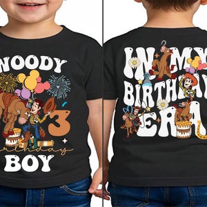 a young boy wearing a woody birthday shirt