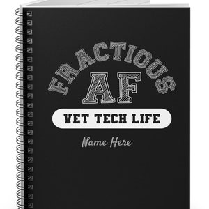 May include: Black spiral-bound notebook with the text "FRACTIOUS AF VET TECH LIFE" in white. The notebook has a white rectangular label with the text "Name Here" below the main text. The pages are white.