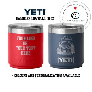 May include: Two Yeti Rambler Lowball tumblers, each 295 ml, with silver lids. One is red with custom text, the other is blue with a cabin and tree design. Text includes "YETI" and "+ COLOURS AND PERSONALIZATION AVAILABLE."