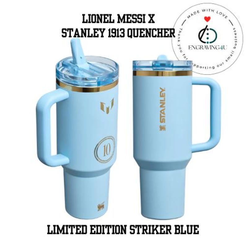 May include: Two light blue Stanley 1913 Quencher tumblers with gold accents and handles. One has a straw, the other a lid. Text includes "LIONEL MESSI X", "STANLEY 1913 QUENCHER", and "LIMITED EDITION STRIKER BLUE".